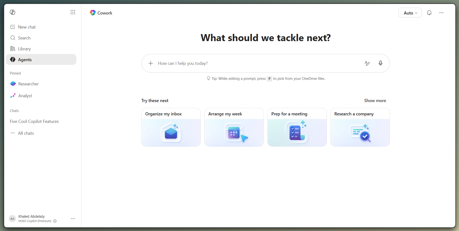 Copilot Cowork home page inside Microsoft 365 Copilot showing the chat input field and suggested prompts such as Organize my inbox, Arrange my week, Prep for a meeting, and Research a company