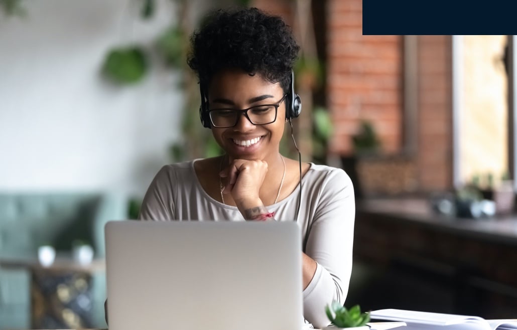 Person watching something on a laptop