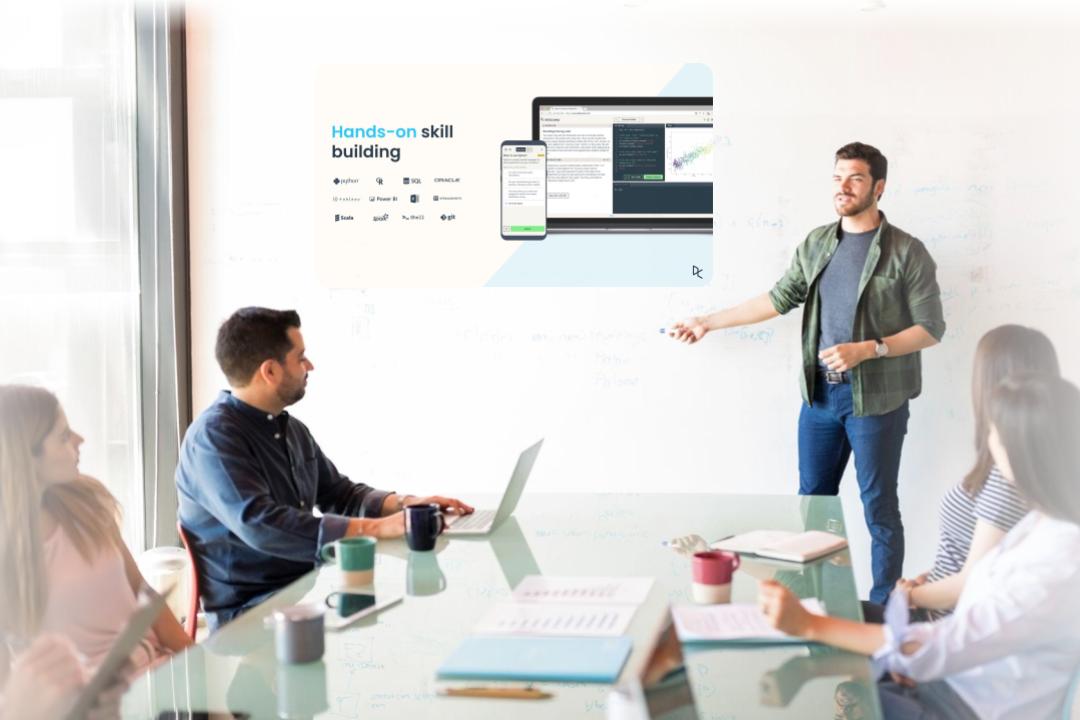 Man giving a presentation on how DataCamp can upskill his employees
